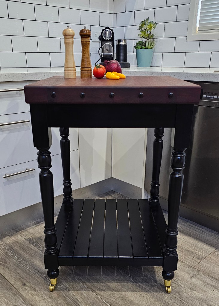 Dark Coloured Butchered Block with Turned Legs and Castors